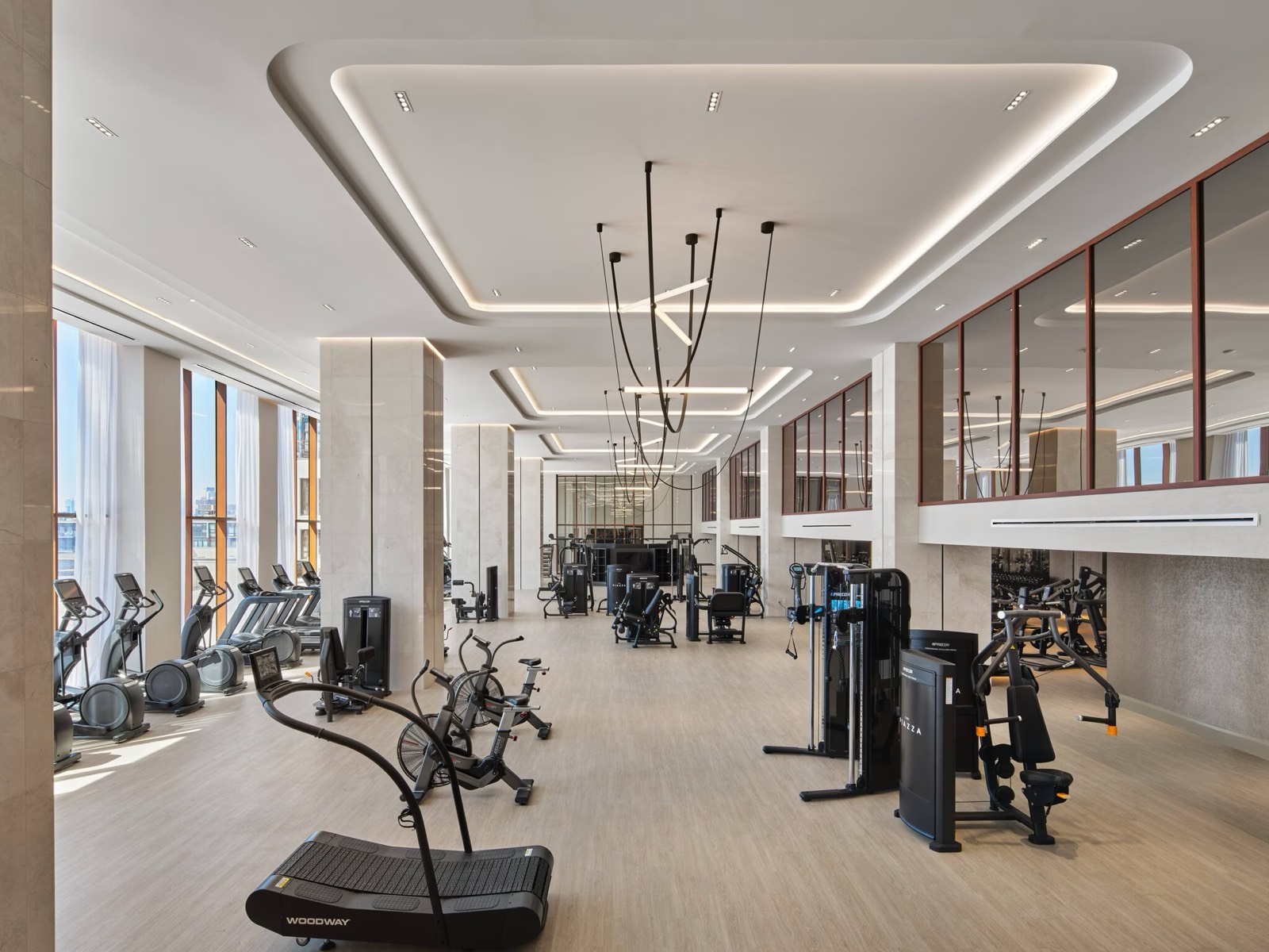 Two-story fitness club with cardio and strength equipment
